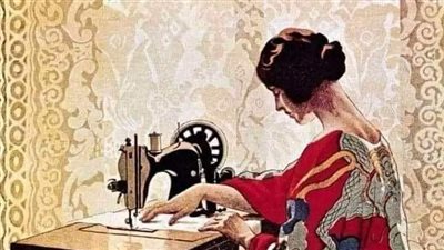 المراه وماكنية الخياطه